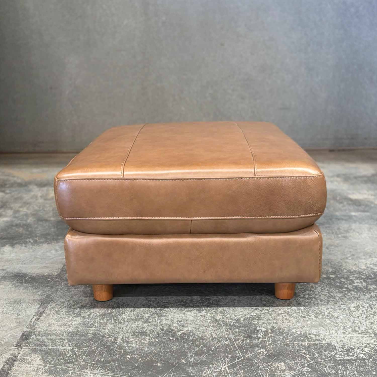 Imperfect Barcelona Leather Ottoman in Derrick Umber
