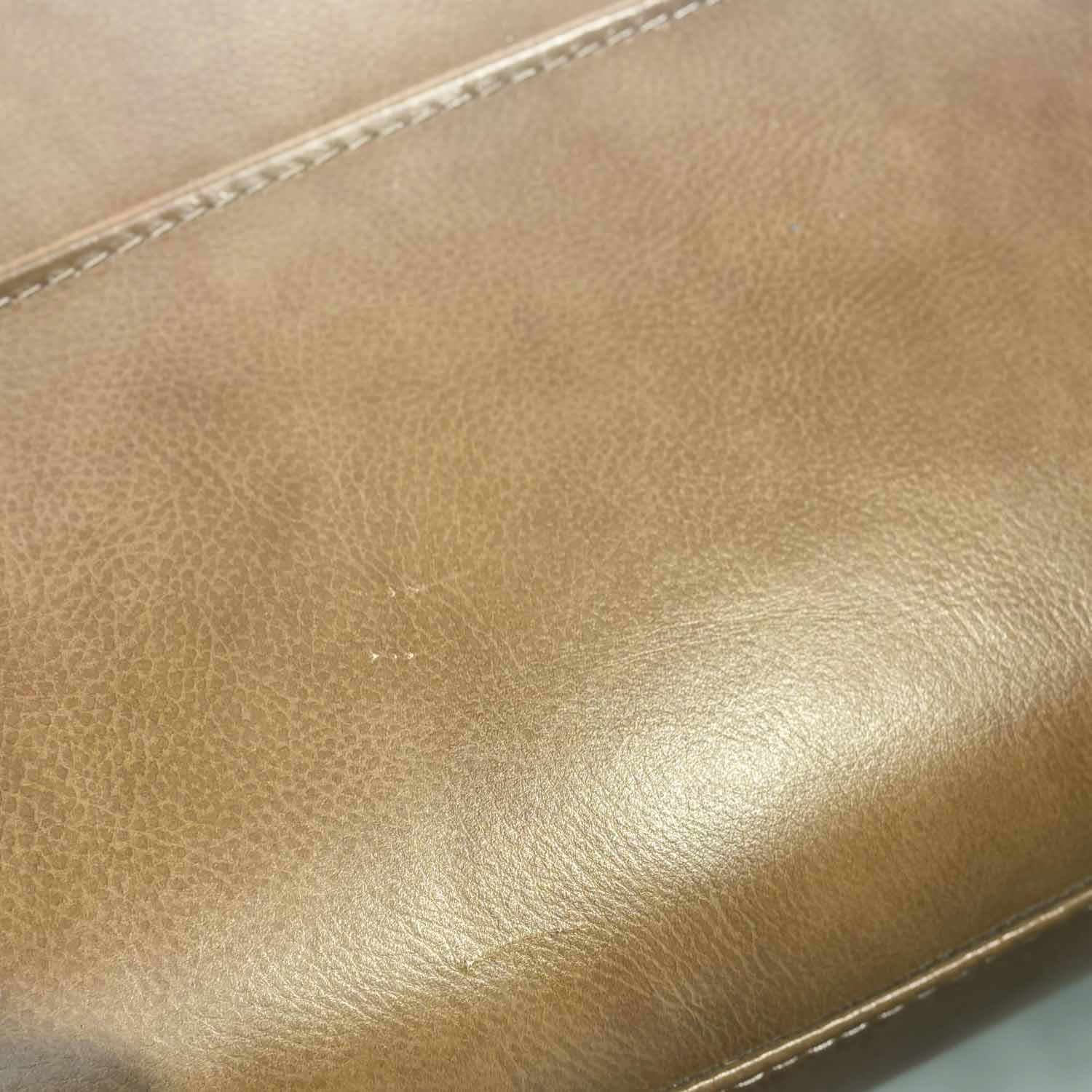 Imperfect Barcelona Leather Ottoman in Derrick Umber