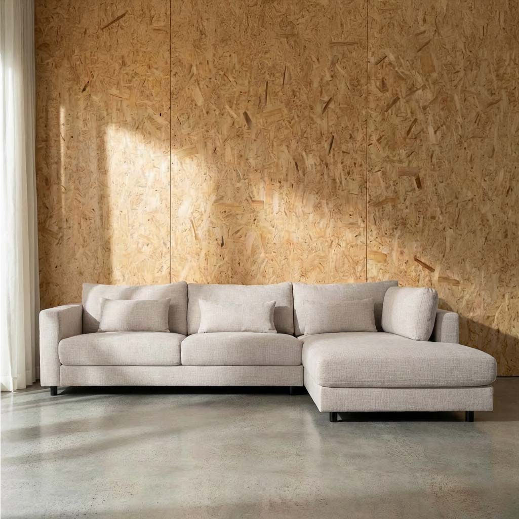 A beige fabric right side facing chaise lounge sofa with a cushioned backrest and a flat seat, featuring a sturdy wooden frame and high-density foam cushions.