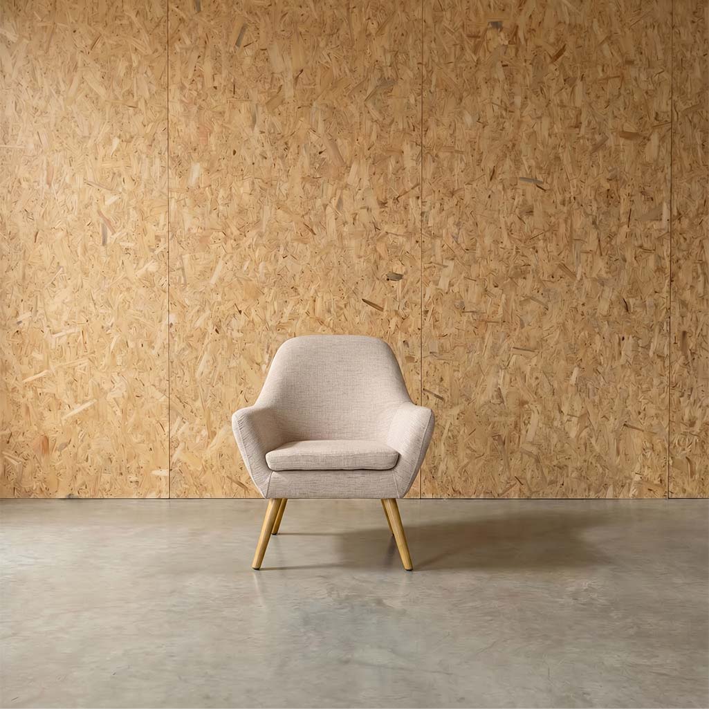 A beige upholstered fabric chair with a sustainably sourced hardwood frame, finished with a natural oak stain, and wooden legs.